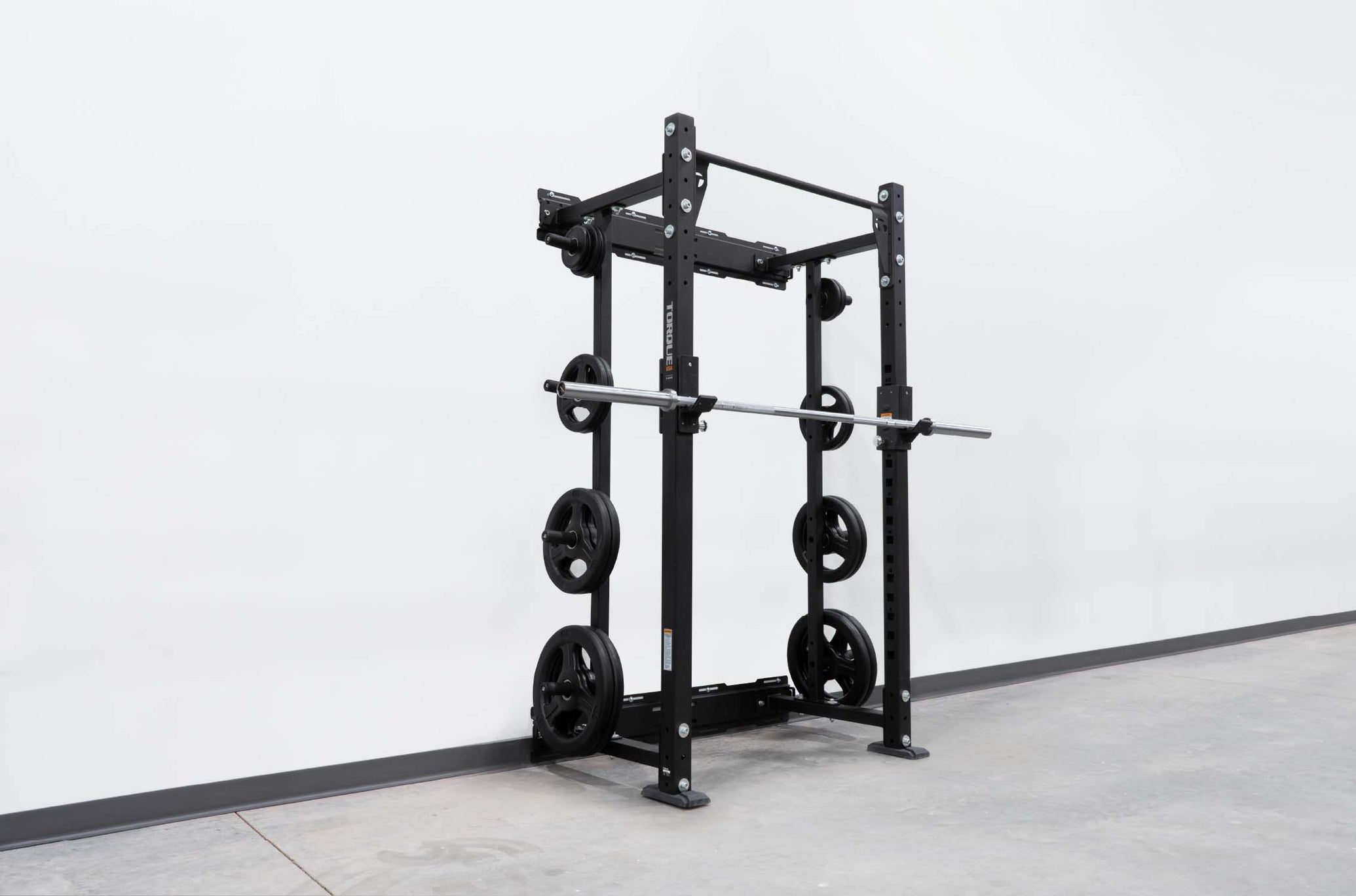 wall-mounted squat rack with bar and plates